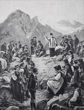 Mountain sermon in the Tyrolean Alps, People in traditional dress gather in the mountains while a