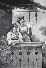 Two woman in traditional dress standing on a balcony, Dirndl, Bavaria, Germany, Historical,