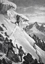 Mountaineer in the snow on the way to a mountain peak, cutting through a snowdrift, Historical,