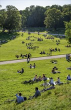 Many people sitting relaxed in the English Garden on a summer's day, English Garden, Munich,