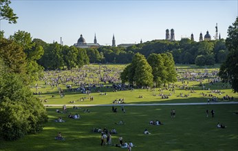 View from the Monopteros in the English Garden, meadows full of visitors on a summer day, Munich