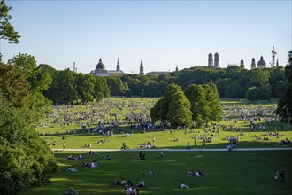 View from the Monopteros in the English Garden, meadows full of visitors on a summer day, Munich