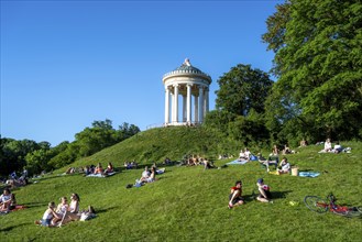 Monopteros in the English Garden, people enjoying the summer day in the park, Munich, Upper