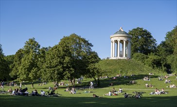 Monopteros in the English Garden, people enjoying the summer day in the park, Munich, Upper