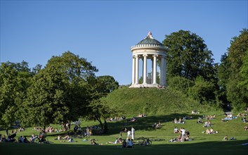 Monopteros in the English Garden, people enjoying the summer day in the park, Munich, Upper