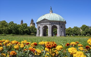 Diana Temple in the Hofgarten with yellow flowers and Theatine Church, Old Town, Munich, Upper