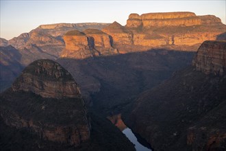 Sunset at Blyde River Canyon with Three Rondawels peak, view of canyon with Blyde River and table