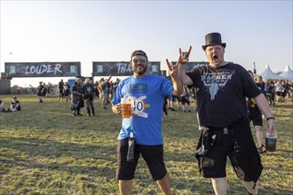 Festival visitors in the entrance area at the Wacken Open Air in Wacken. The traditional metal