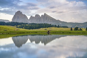 Reflection of Langkogel and Plattkogel, Alpe di Siusi, Dolomites, South Tyrol