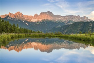 Mountains reflected in a small mountain lake, sunset, evening light, Wuhnleger Weiher, view of rose