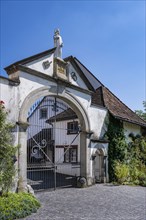 Lower entrance to Ittingen Charterhouse, a former Carthusian monastery with a statue of Bruno of