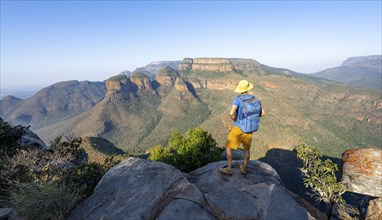 Tourist enjoying the view of the canyon, Blyde River Canyon with Three Rondawels peak, View of