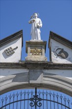 Statue of Bruno of Cologne, founder of the Carthusian Order, on the archway of the lower entrance