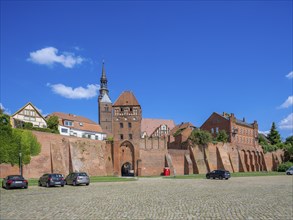 Town wall at the harbour with Elbe gate and tower of the Protestant church of St. Stephan,