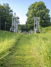 Landing stage of the historic railway ferry with overgrown old rails on the banks of the Havel in