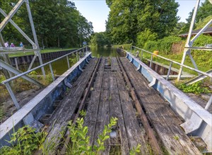 Landing stage of the historic railway ferry with overgrown old rails on the banks of the Havel in