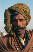 Portrait of a farmer (Rajasthan, India) . The turban indicates the caste, the region of the man who