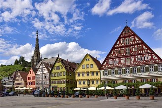 Half-timbered houses on the market square of Esslingen am Neckar, in the background the tower of