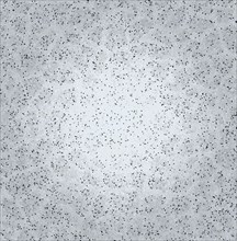 Grey speckled textured surface appearing like concrete with a rough abstract pattern