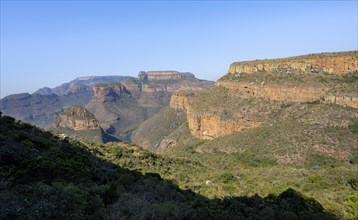 Blyde River Canyon with Three Rondawels peak, view of canyon with Blyde River and Mesa Mountains in