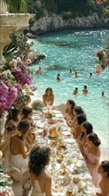 An elegant beach dinner party with a group of women seated around a table by a turquoise ocean, AI