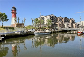 Museum harbour with boats and lighthouse, Büsum, Dithmarschen, Schleswig-Holstein, Germany, Europe