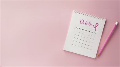 October calendar with a breast cancer awareness pink ribbon and a pencil with copyspace, AI