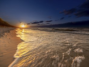 Sunset on a sandy beach on the island of Usedom on the Baltic Sea, Zempin, Mecklenburg-Western