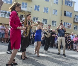 Jazz musicians, The Carling family, play on the street in Ystad in the opening of the Ystad Jazz