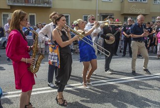 Jazz musicians, The Carling family, play on the street in Ystad in the opening of the Ystad Jazz