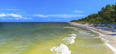 Sandy beach beach with clouds in the blue sky on the island of Usedom on the Baltic Sea, Zempin,