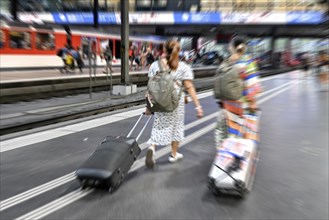 Wipe-off picture SBB railway station passers-by with trolley case