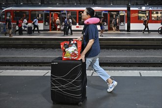 SBB railway station passer-by with trolley case