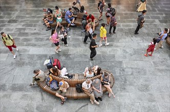 Young and old bench with mobile phone