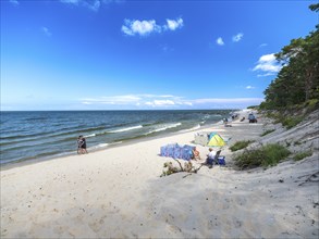 Sandy beach beach with clouds in the blue sky on the island of Usedom on the Baltic Sea, Zempin,