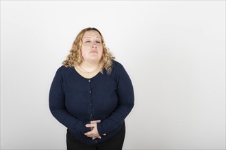 Woman with stomach ache on white background