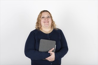 Portrait of blonde plus size woman looking at camera smiling