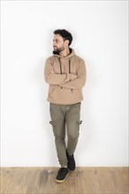 Portrait of a latin man looking to the side. White background