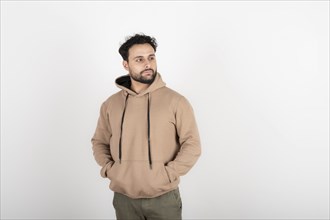 Portrait of a latin man looking to the side. White background