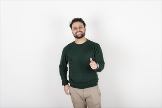 Man looking at camera smiling with thumb up