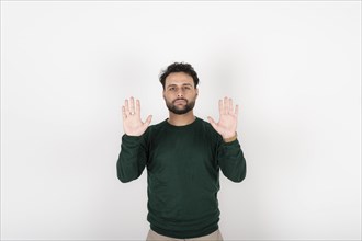 Man showing palm hands. White background