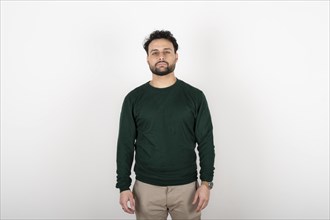 Portrait of young man with serene expression looking at the camera