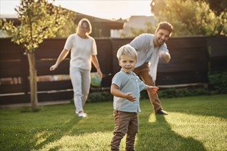 A little boy plays in the garden while his parents stand and smile in the background, ai generated,