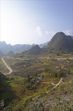 Road and karst hills in the Dong Van Karst Plateau UNESCO Global Geopark, Ha Giang Province,