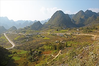 Road and karst rocks in the Dong Van Karst Plateau UNESCO Global Geopark, Ha Giang Province,