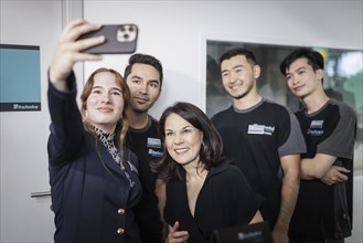 Annalena Bärbock (Alliance 90/The Greens), Federal Foreign Minister, pictured with young employees,