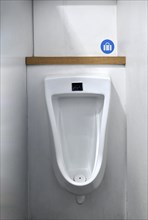 Urinal with bag holder