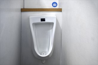 Urinal with bag holder