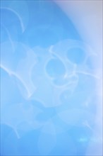 Background of unfocused droplet texture with blue tones, AI generated