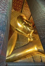 Close-up of the Reclining Buddha statue, Wat Pho complex, Bangkok, Thailand, Asia